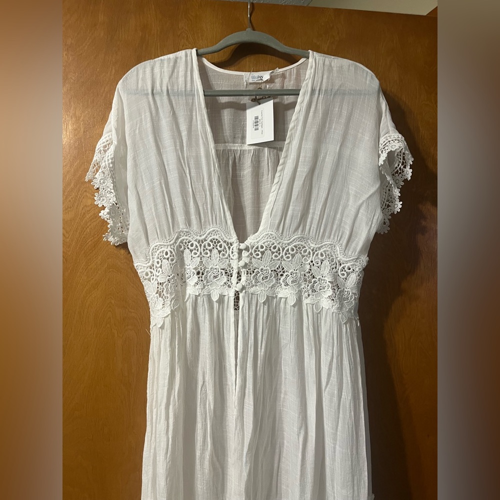 Long white swimsuit cover up/ layering piece.